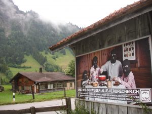 "Are we Swiss all criminals?" The poster asks.