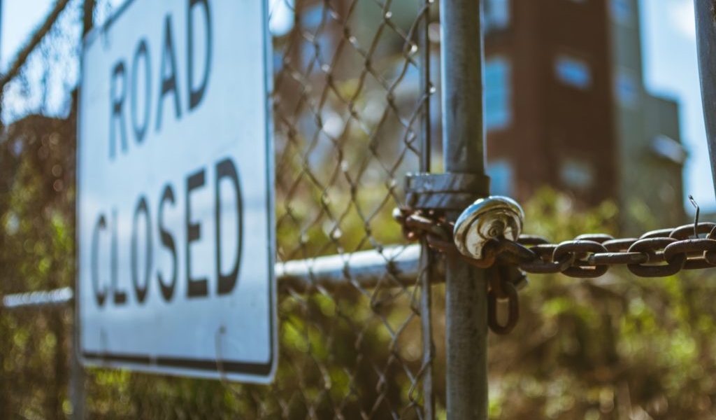 chained gate fence road closed sign chained gate fence road closed sign