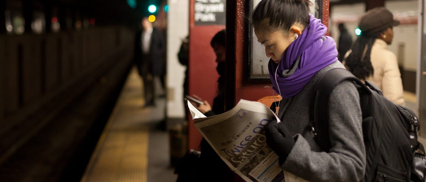 reading newspaper underground