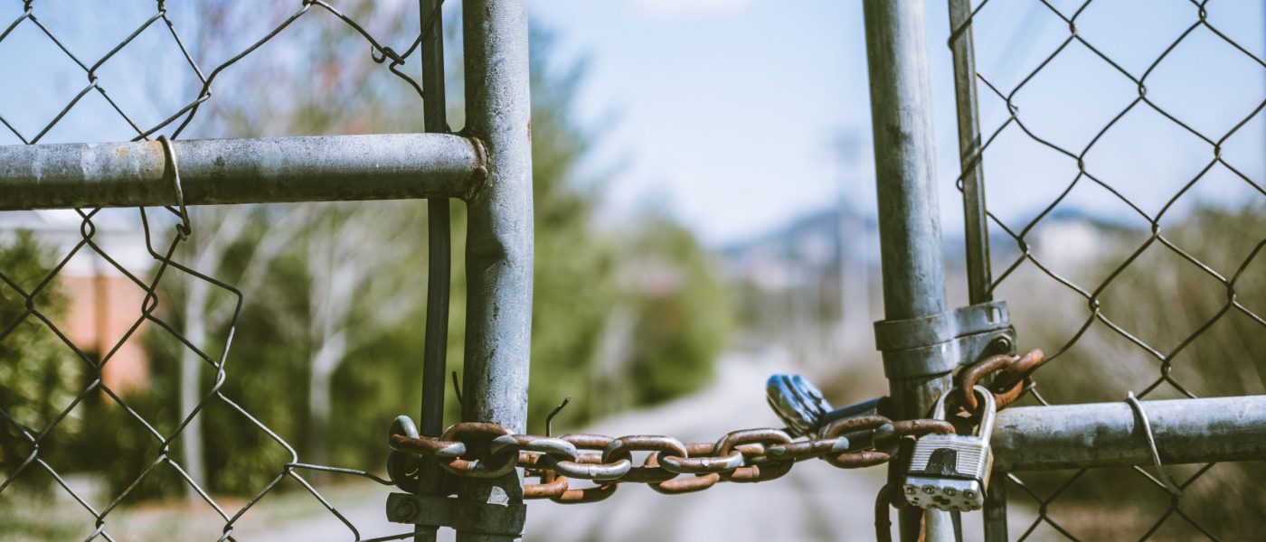 fence-in-shallow-photography Chain locked fence