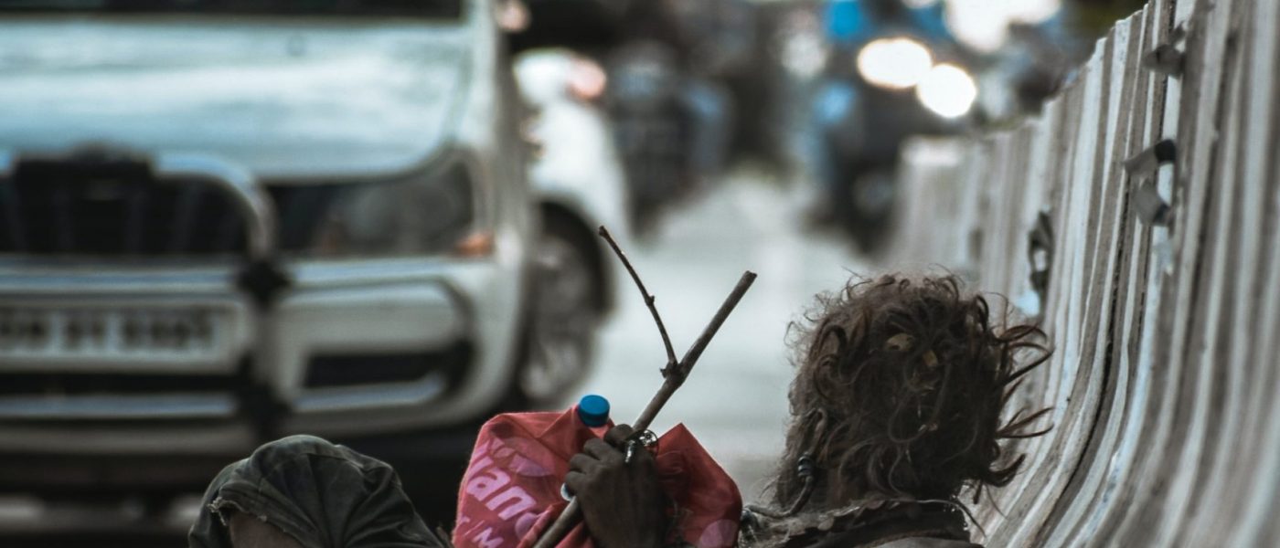 man-sitting-at-the-side-of-the-road-leaning-back-on-road-3107799