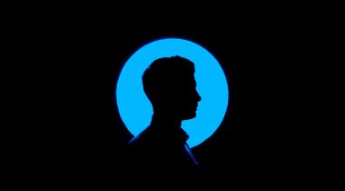 silhouette profile of a man, blue circle background