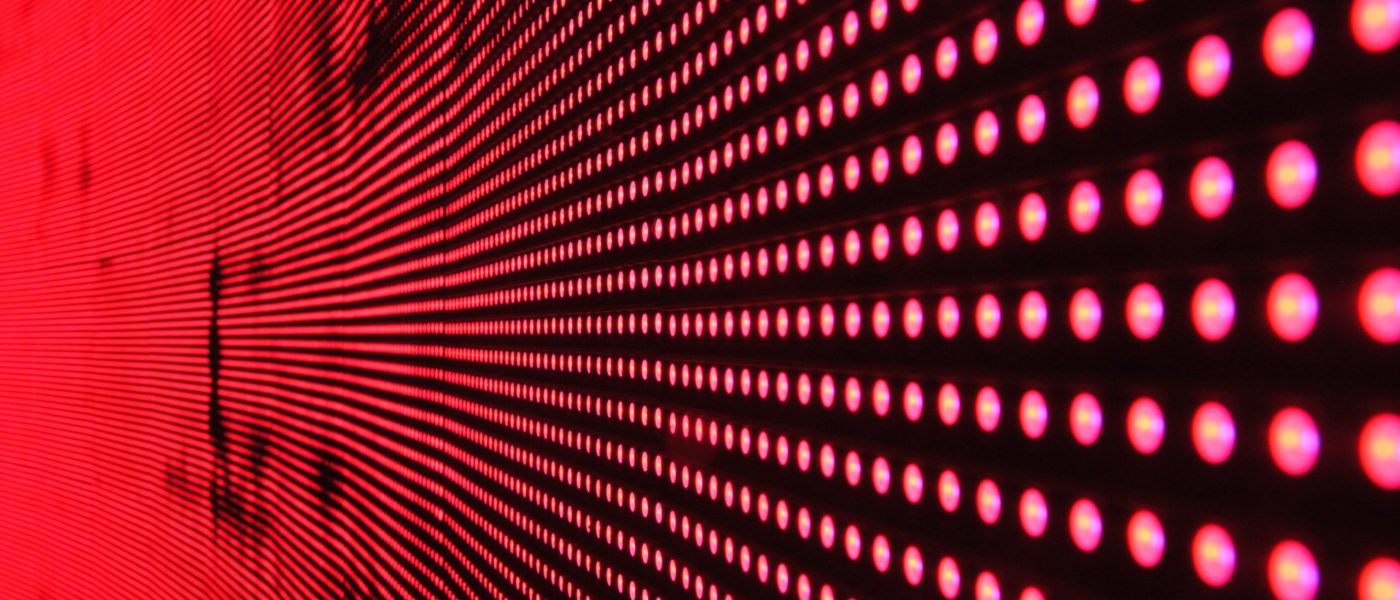 red-lights-in-line-on-black-surface-digital Rows of red lights on a black surface