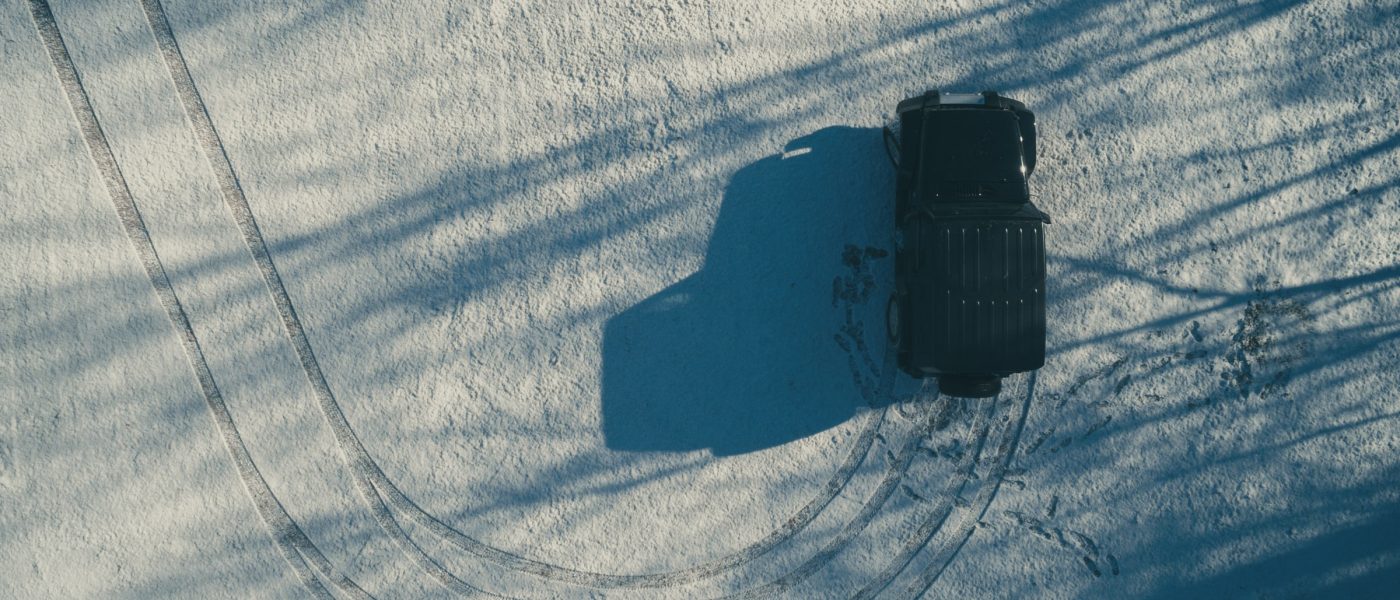 Jeep u-turns in the snow A jeep u-turns in the snow